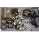 Box of assorted napkin rings and miniature trophy cups, tea spoons etc, some silver. (B.P. 21% +