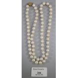 String of well matched cultured pearls with pierced gilt metal filigree clasp. (B.P. 21% + VAT)