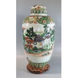 Chinese export porcelain famille Verte ovoid vase and cover painted with figures and a boat in a