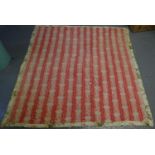 Vintage handmade cotton quilt with striped and floral printed design and patterns sewn in, double