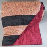 Small vintage cotton patchwork quilt with paisley and black rectangular stripes to one side and