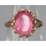 Yellow metal pink stone ring, size I 1/2, 2.2g approx. (B.P. 21% + VAT)