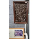 19th century carved oak panel depicting stylised Dolphin amongst seaweed. 52x30cm approx. Framed. (
