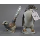 Lladro Spanish porcelain study of a penguin together with another of a bird, possibly a wagtail. (2)