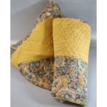 Small patchwork cotton quilt with paisley and mustard colour patches, plain mustard to reverse.