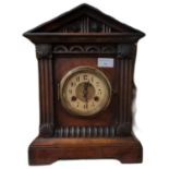 Early 20th century walnut architectural two train mantle clock. 38cm high approx. (B.P. 21% + VAT)