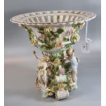 Early 20th century Von Schierholz porcelain figural comport, the basket bowl applied with roses