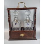 Victorian style mahogany and brass two section tantalus with two Edinburgh Crystal decanters and