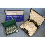 Art Deco engine turned cased ladies vanity set of four hand brushes and one hand mirror, the box