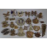 Collection of assorted British Military cap badges, shoulder flashes and other related items, to