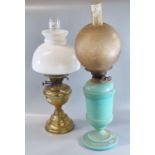 Two double burner oil lamps, one on a turquoise opaline glass reservoir and base. (2) (B.P. 21% +