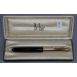 Black Parker 51 fountain pen with rolled gold cap, in original card box. Bearing initial G H. (B.