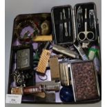 Tin box of oddments, to include: lighters, scissors, costume bracelet etc. (B.P. 21% + VAT)