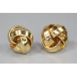 Pair of yellow metal knot earrings. (B.P. 21% + VAT)