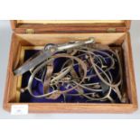Carved wooden box comprising a collection of riding boot spurs. (B.P. 21% + VAT)