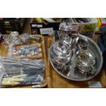 Two trays of metalware, mostly silver plate to include: a plated four piece tea and coffee