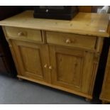 Pine cupboard base, the moulded top above two drawers with two blind panelled cupboards to the