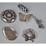 Collection of six silver brooches, to include: filigree butterfly, marcasite lizard etc. (B.P. 21% +