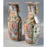 Pair of Chinese porcelain Canton Famille Rose vases with alternating panels of figures in