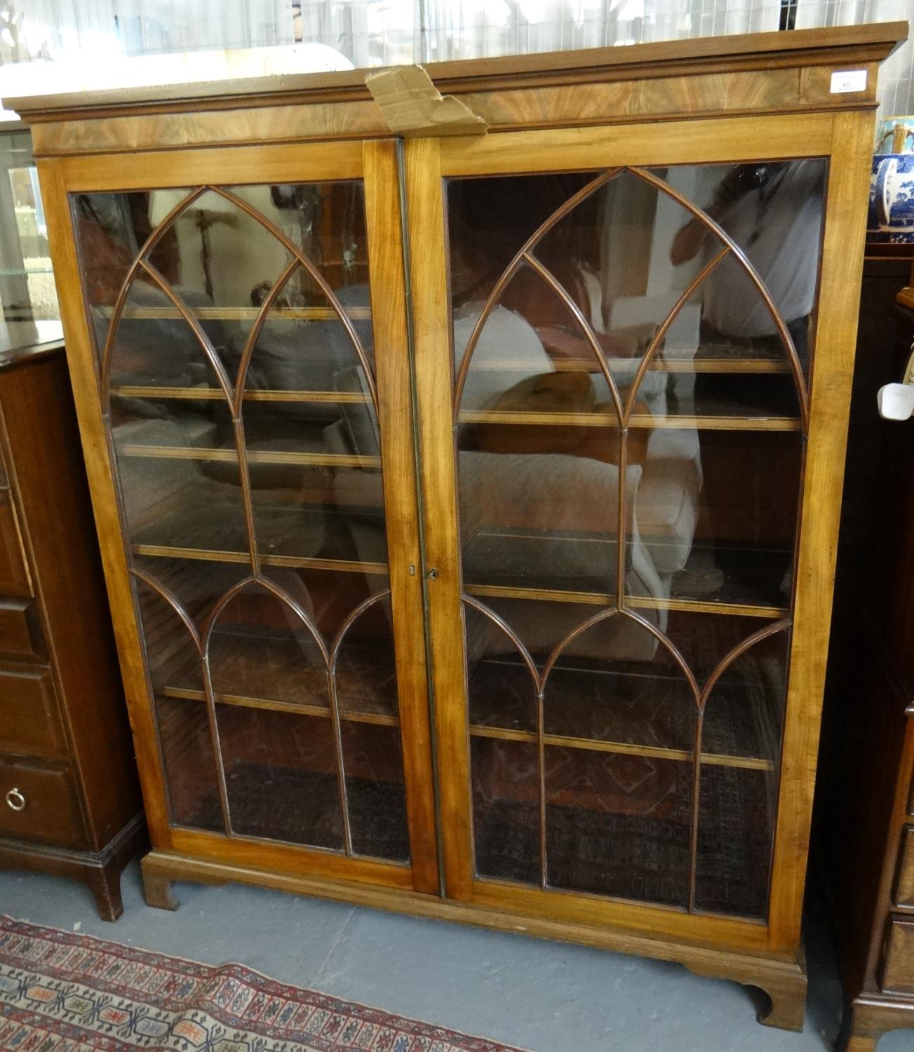 Good quality mahogany two door glazed bookcase, the interior revealing adjustable shelves. (B.P. 21%