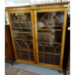 Good quality mahogany two door glazed bookcase, the interior revealing adjustable shelves. (B.P. 21%