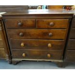 19th century oak straight front chest of two short and three long drawers having turned handles on