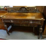 Victorian oak ornately carved two tier buffet with carved mask head mounts. (B.P. 21% + VAT)