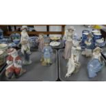 Two trays of various Nao Spanish porcelain figures to include: Santa Claus, clown, various ladies