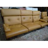 Tetrad retro orange ground leather three seater sofa together with a matching swivel lounge chair on