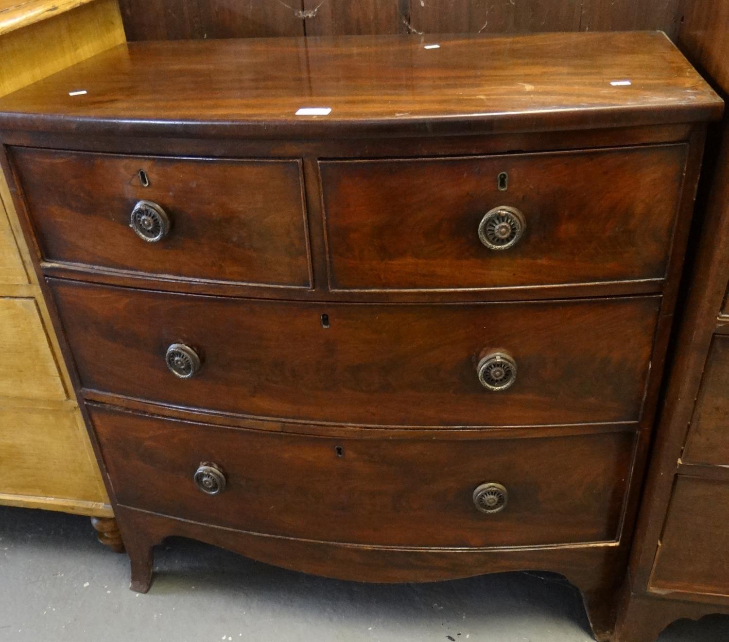 19th century mahogany bow front chest of two short and two long drawers on bracket feet.