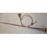 Long copper Post horn together with a French style copper scroll shaped hunting horn. (2) (B.P.