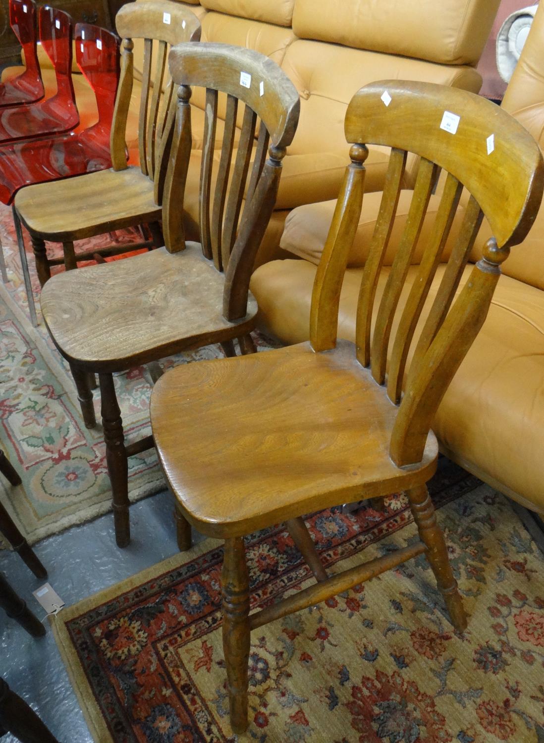 Set of three late 19th early 20th century elm slat back farmhouse kitchen chairs. (3) (B.P. 21% +