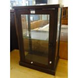 Early 20th century stained oak single glazed table top display cabinet, the interior revealing one