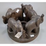 Modern pottery study of a herd of four elephants on circular base. (B.P. 21% + VAT)