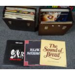 Two vintage record cases containing various vinyl LP's to include: Thin Lizzie 'Bad Reputation',