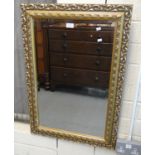 Modern gilt framed bevel plate mirror decorated with moulded foliage. 84x59cm approx. (B.P. 21% +