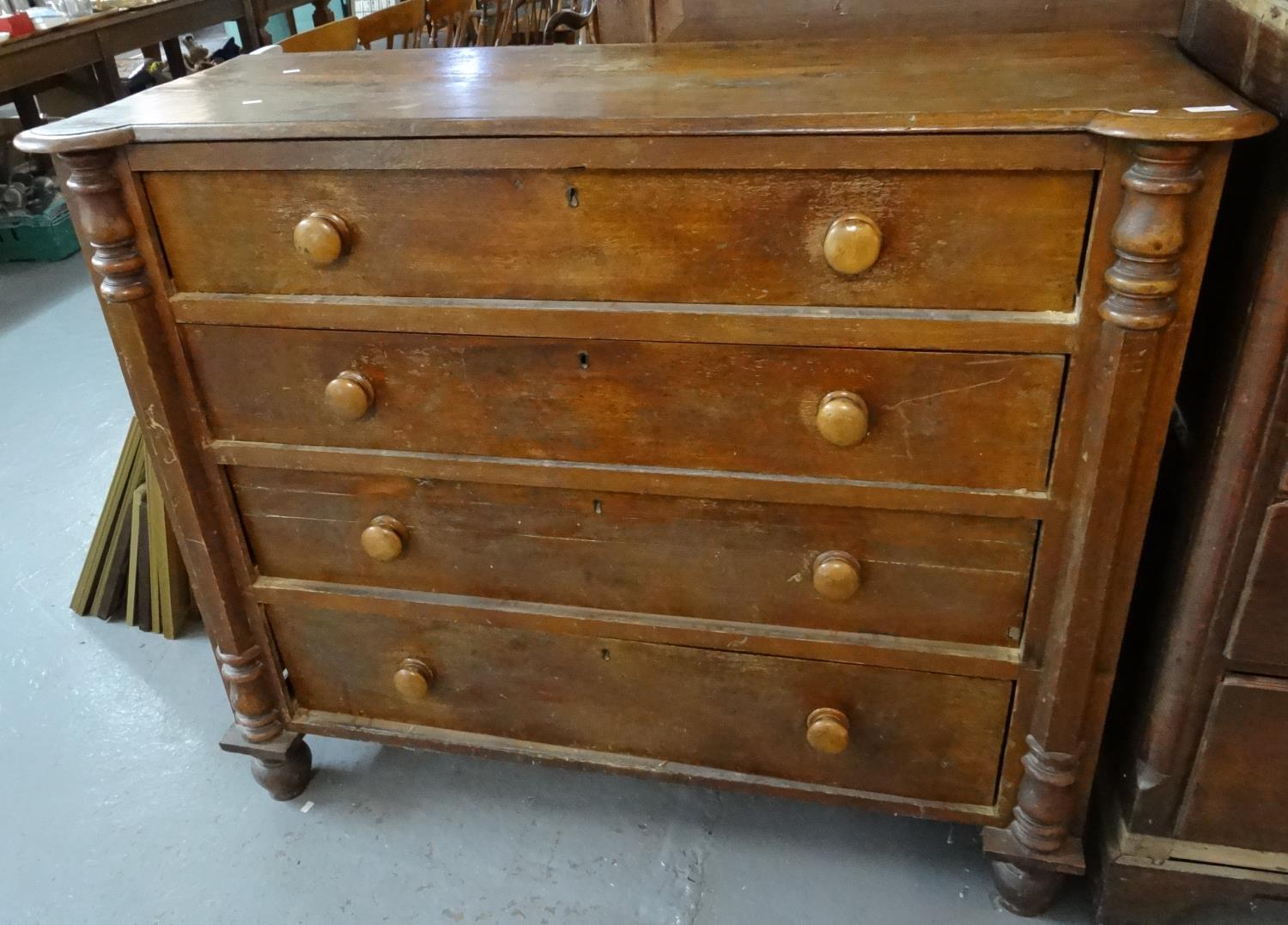 Victorian mixed woods straight front chest of four long drawers flanked by moulded pilasters.