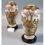 Pair of Japanese Satsuma vases on stand with a polychrome motif of exotic birds, flowers and trees