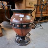 Metal mounted urn shaped stand with wrought metal mounts. 45cm high approx. (B.P. 21% + VAT)