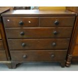 19th century oak straight front chest of two short and three long drawers having ebonised turned