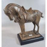 Cast patinated metal Tang style horse on rectangular plinth. 25cm high approx overall. (B.P. 21% +