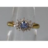 18ct gold blue and clear stone cluster ring. 3.7g approx. Size L 1/2. (B.P. 21% + VAT)