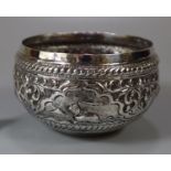 Early 20th century white metal, probably Indian bowl decorated with animals amongst foliage. 1.9