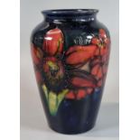 Moorcroft pottery tube lined Orchid vase, impressed marks and signature to the underside. 16cm