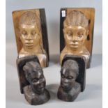 Two pairs of African carved hardwood figural bookends. 18.5 cm and 10.5cm high approx. (4) (B.P. 21%