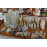 Tray of hardstone carved items mostly animals; elephants, horse head bookends, dogs, horses, eggs,