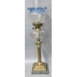 Early 20th century double oil burner lamp having blue frilled and frosted etched glass shade above