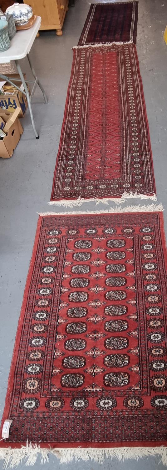 Three Middle Eastern red ground geometric, floral and foliate red ground runners. (3) (B.P. 21% +