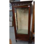 Edwardian mahogany single door glazed display cabinet with glass shelves and moulded ribbon and swag