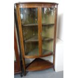Edwardian mahogany bow front two door glazed display cabinet with under tier on out-swept legs. (B.